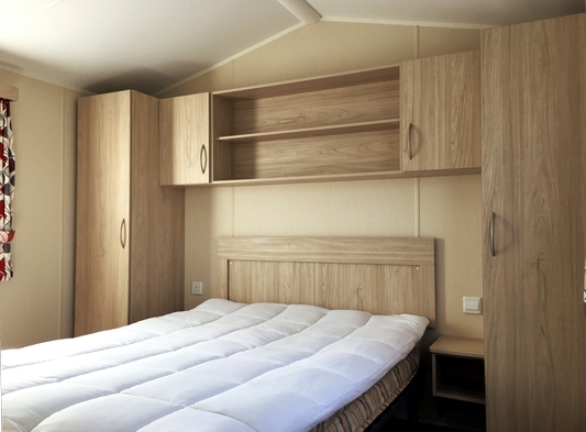 Photo of the main bedroom in one of our holiday caravans